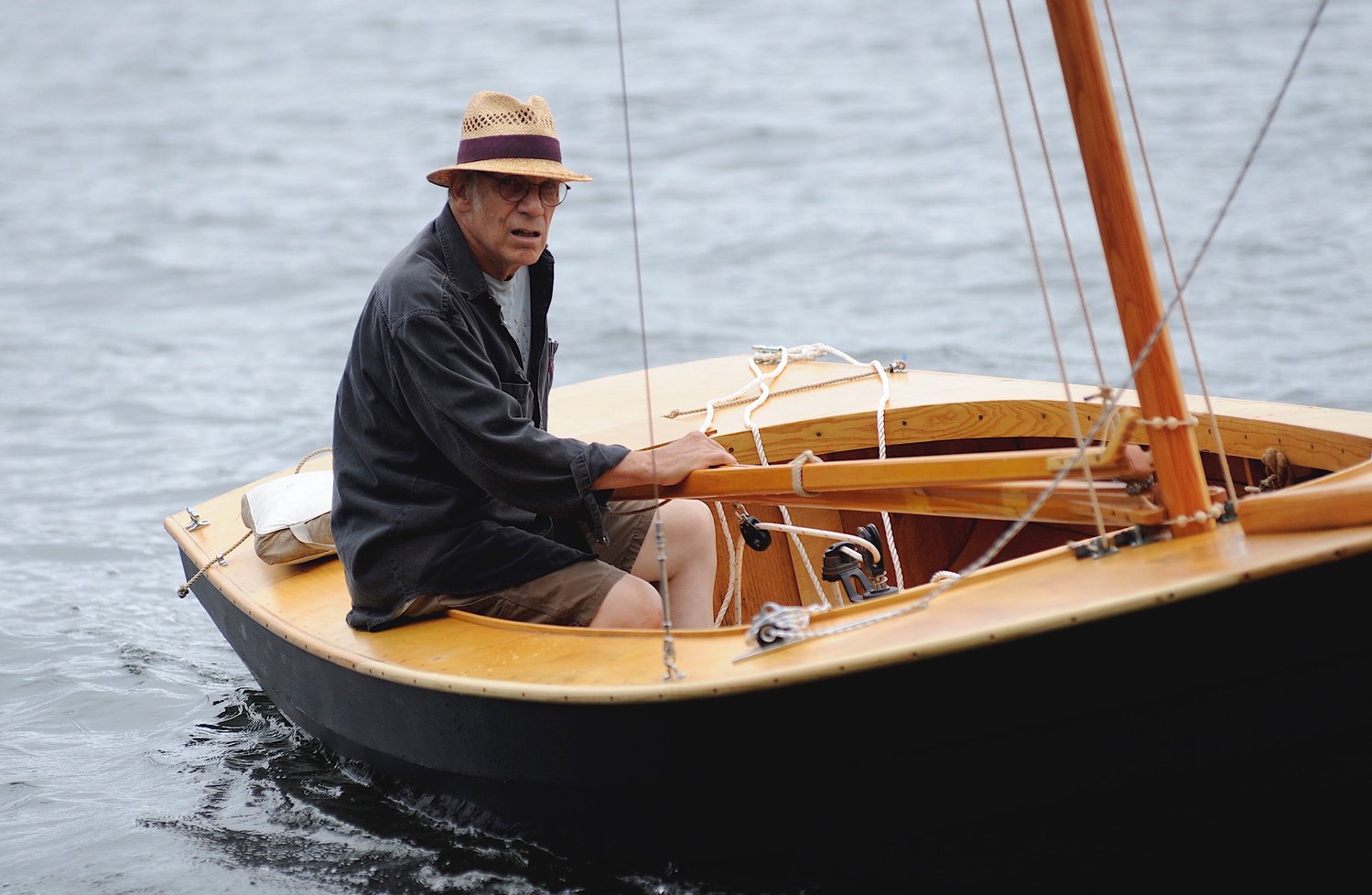 Close hauled. Steve Morse, a local artist who creates woodcut prints, heads to the dock at the Fat Lady Café in his 2000 Narwhal sailboat. As the sails were not yet rigged, he caught a tow from fellow wooden boat enthusiast Bruce Bidwell.